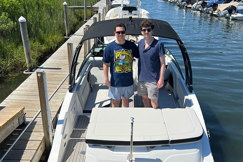 photo of boat and owner from a new Modern Yacht delivery