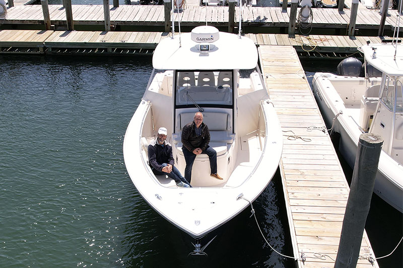 photo of boat and owner from a new Modern Yacht delivery
