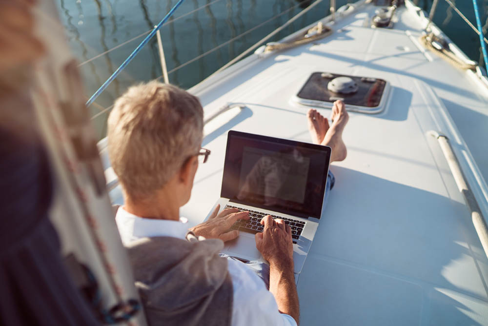 Man on a Boat with Laptop