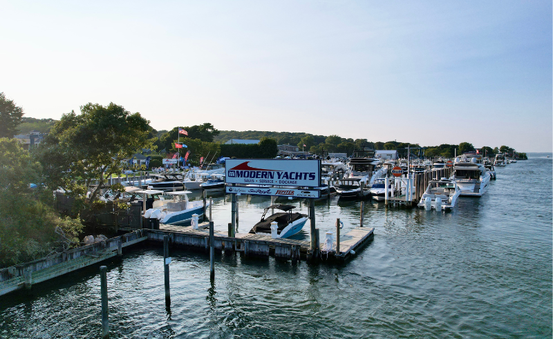 Modern Yachts marina sign on the water