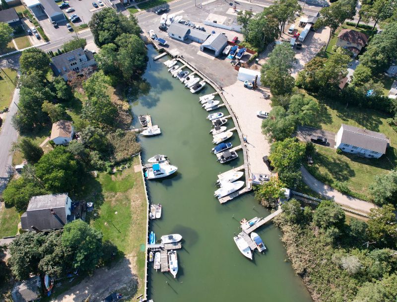 Overhead shot of Mattituck marina with boats docked on both sides of the inlet