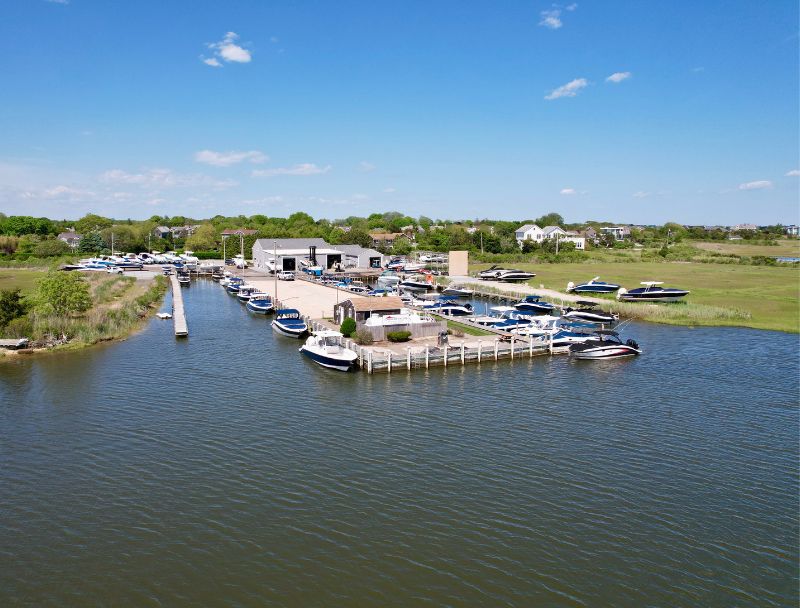 Drone shot of Westhampton marina from the water showing docks and service buildings