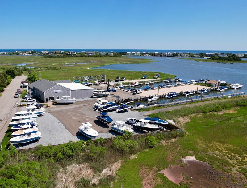 Aerial photo of Westhampton marina with slips, buildings, and surrounding wetlands