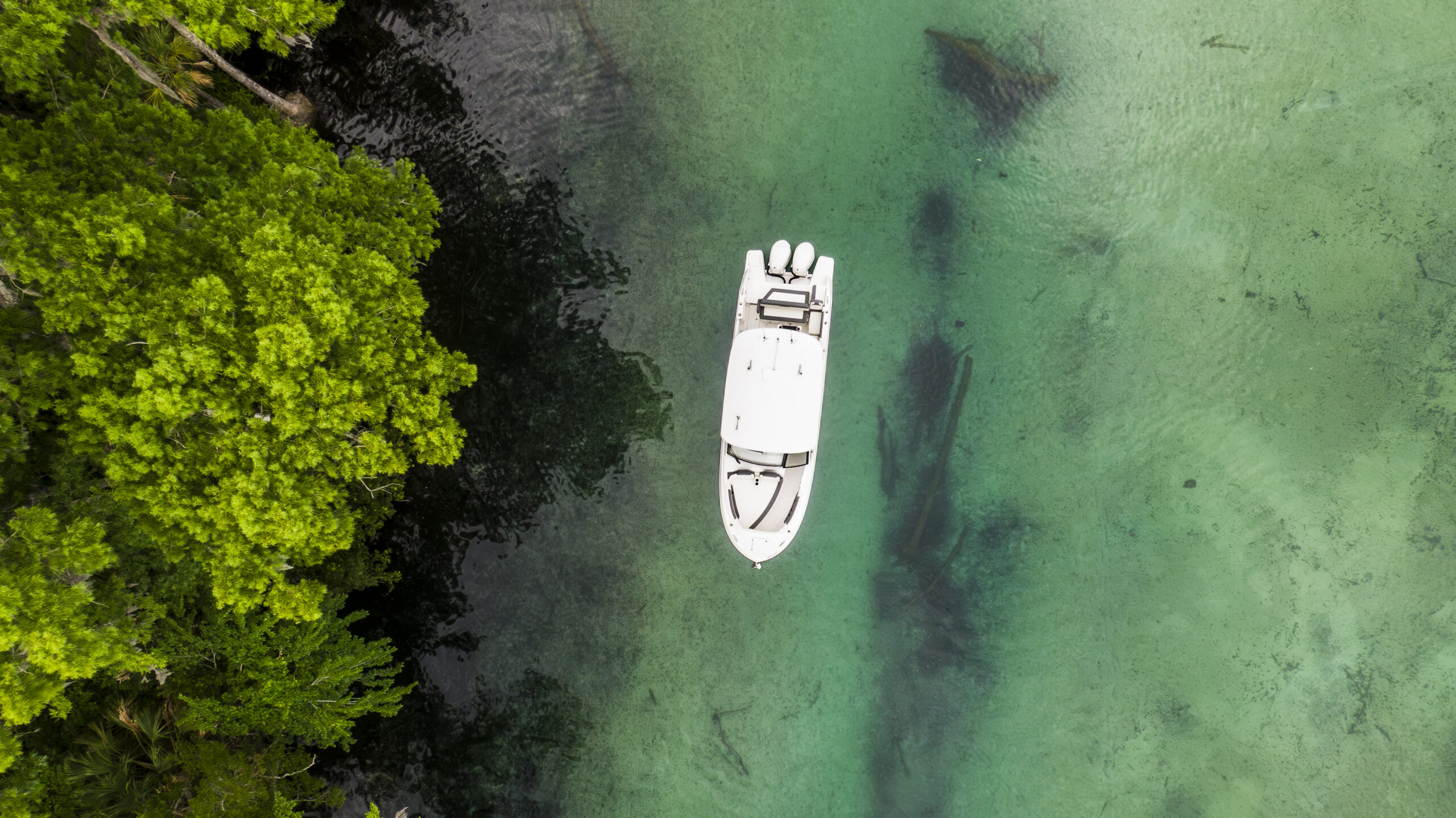 Aerial drone shot of the Edgewater 310SC on the water