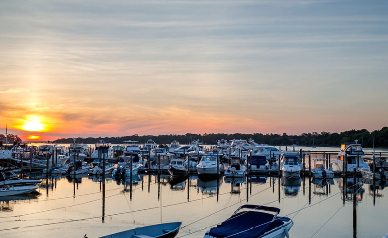 Boats docked at Sag Harbor Village Marina at the foot of Main Street on Long Island's East End