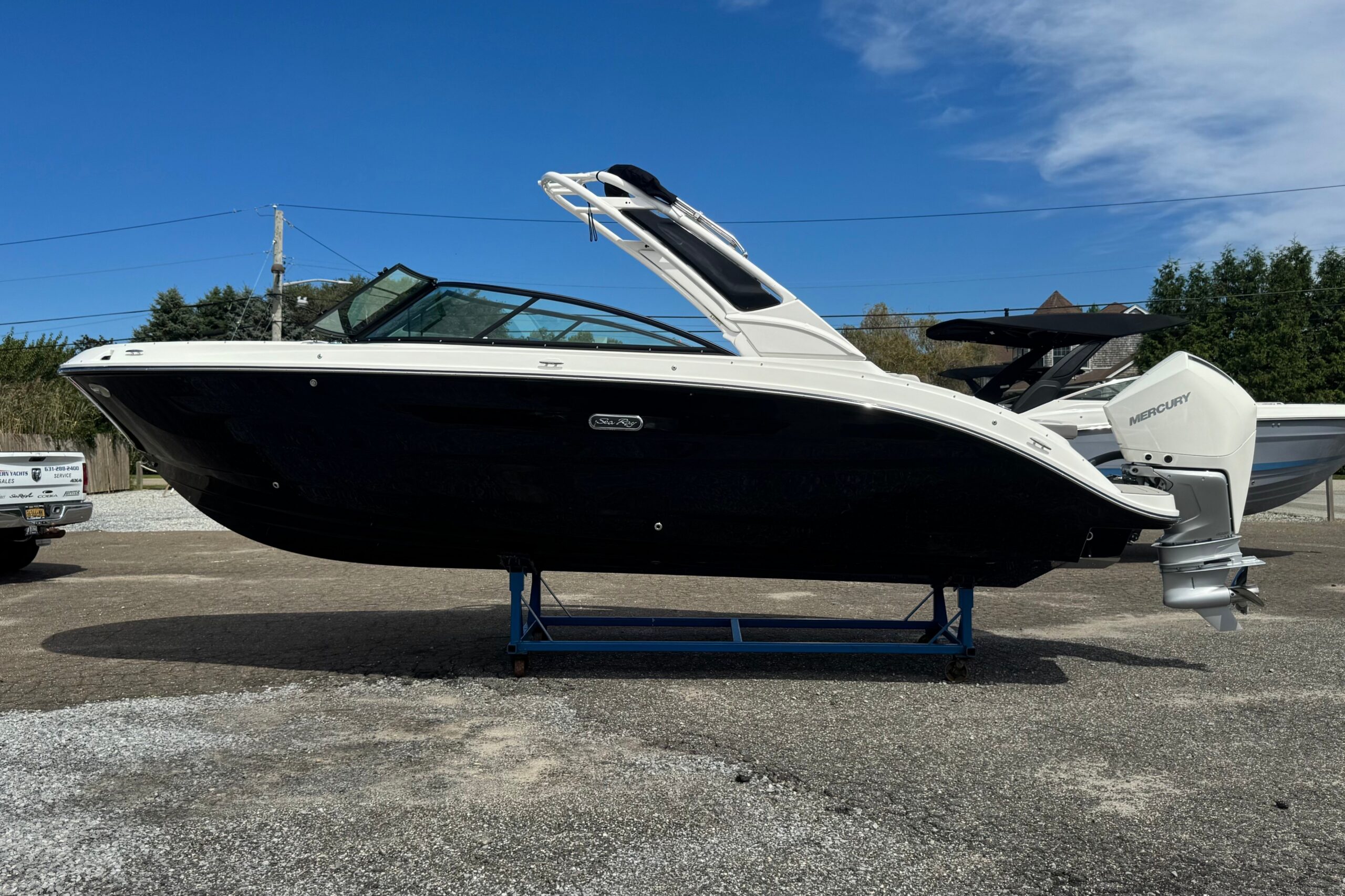 2027 Sea Ray SDX 250 Outboard with black hull, featured in the Show Stopping Deals Sales Event at Modern Yachts.